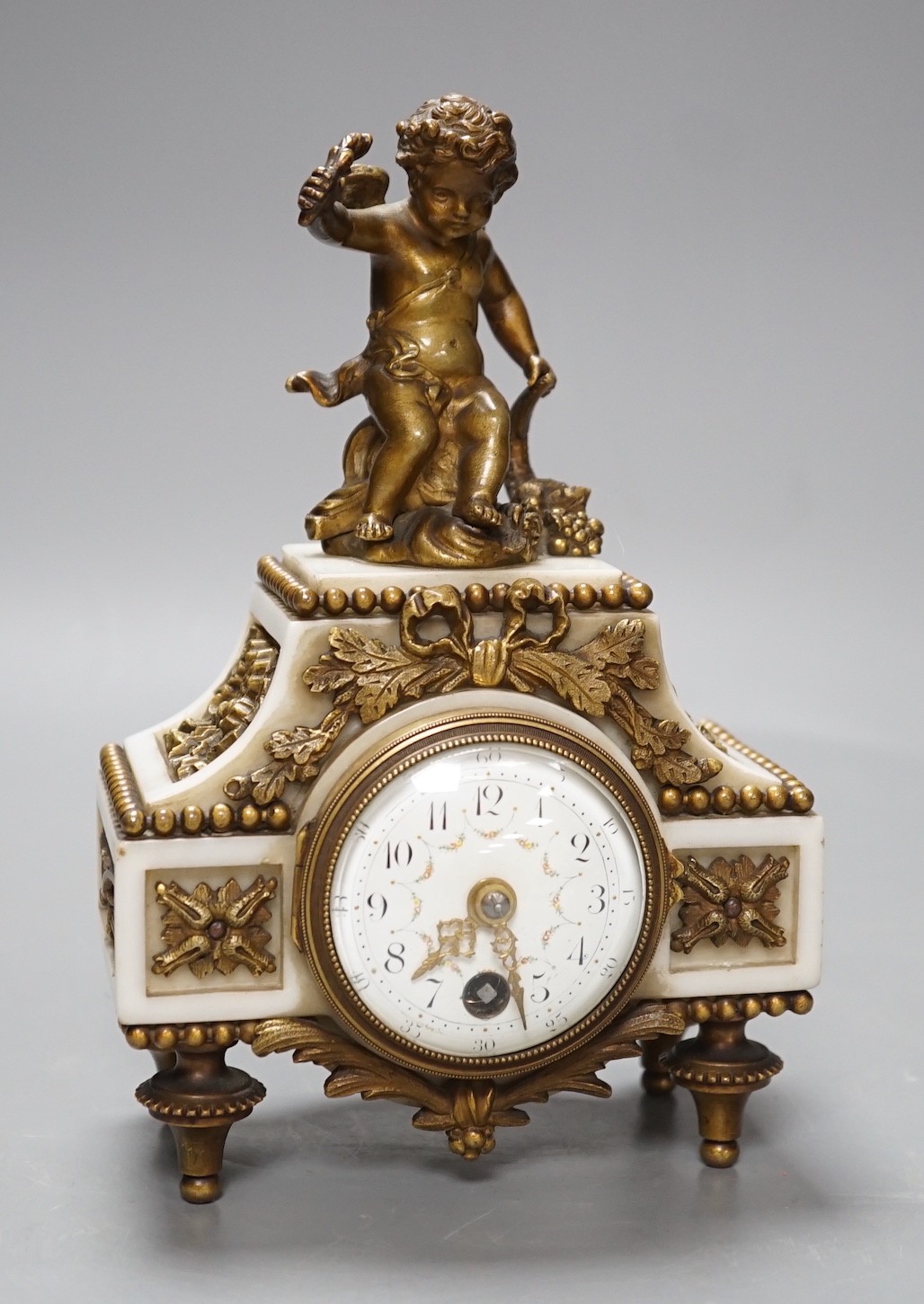 An early 20th century French marble and ormolu cherubic timepiece, height 19cm